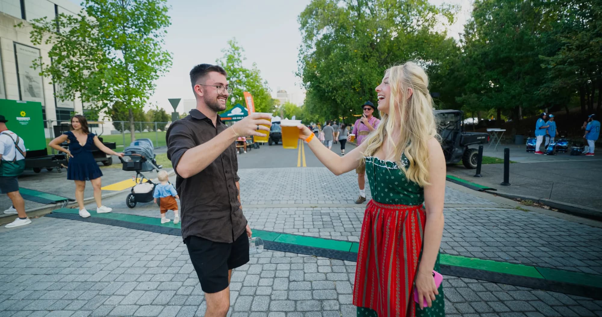 A couple toasting with beer at Nashville Oktoberfest